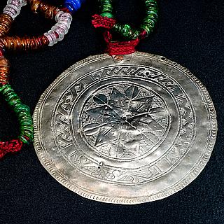 Necklace with glass rings and large metal disk 02.04.1352